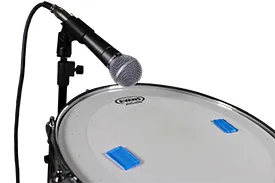 Shure SM58 microphone miking a snare drum