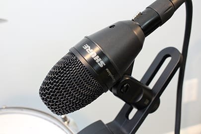 Shure PGA56 drum mic closeup mounted on drum
