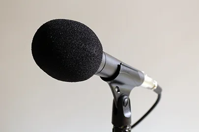 Shure SM58 mic with popper stopper foam windscreen for podcasting